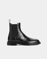 Side view of black leather Chelsea boots