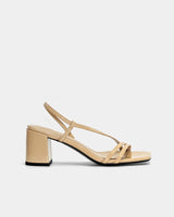 Side view of nude strappy sandals with block heel