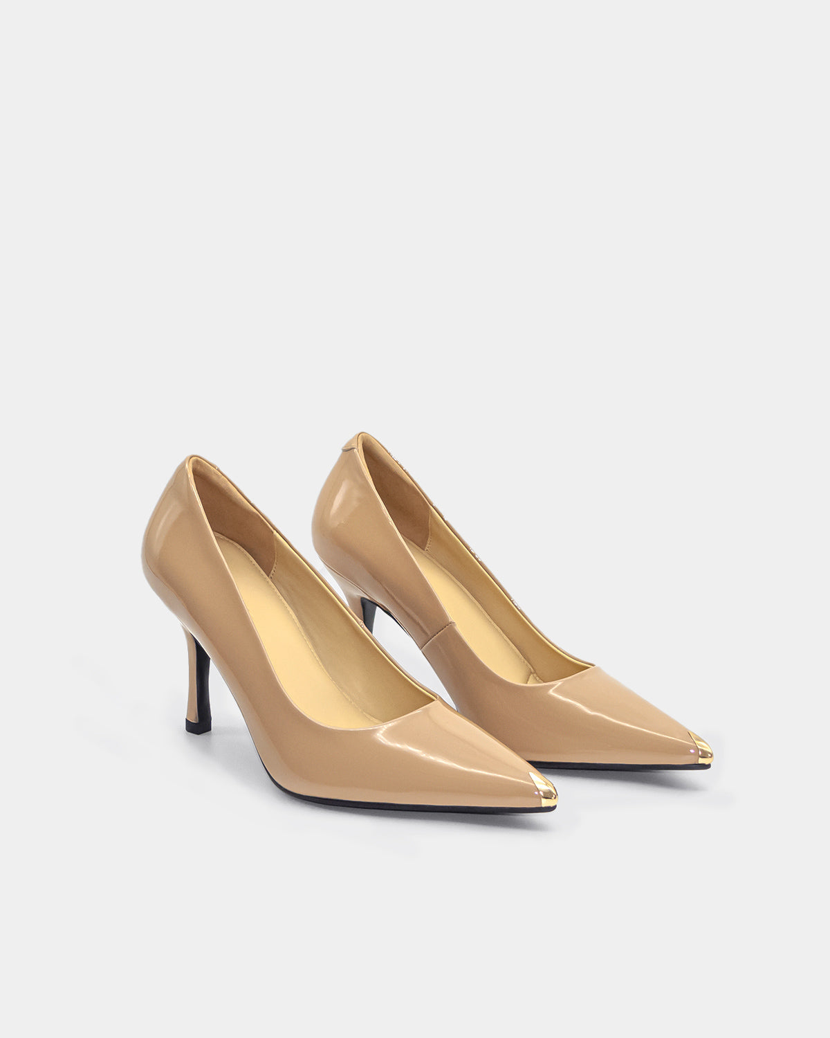 A pair of high heel pumps in nude leather
