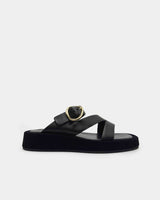 Black platform sandal with a gold buckle