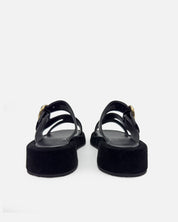 Black sandals with platform sole in suede leather