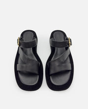 Pair of black sandals with arch support footbed and comfort straps