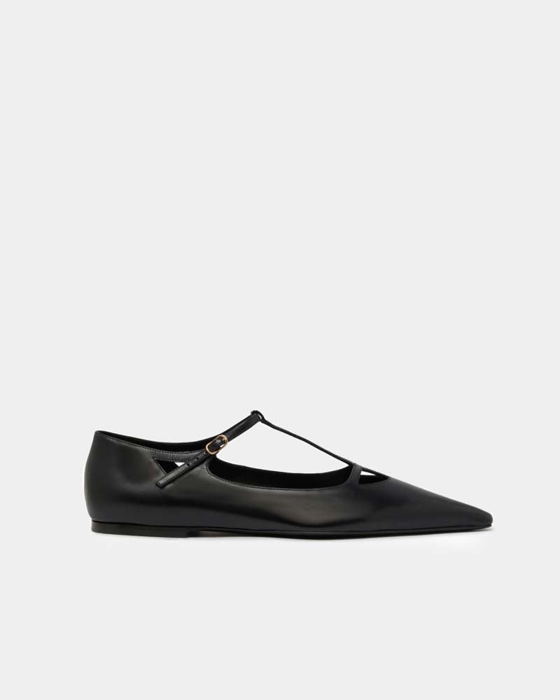 side view of black flats with t strap in leather