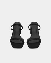 Black heeled slide sandals with padded leather footbed 