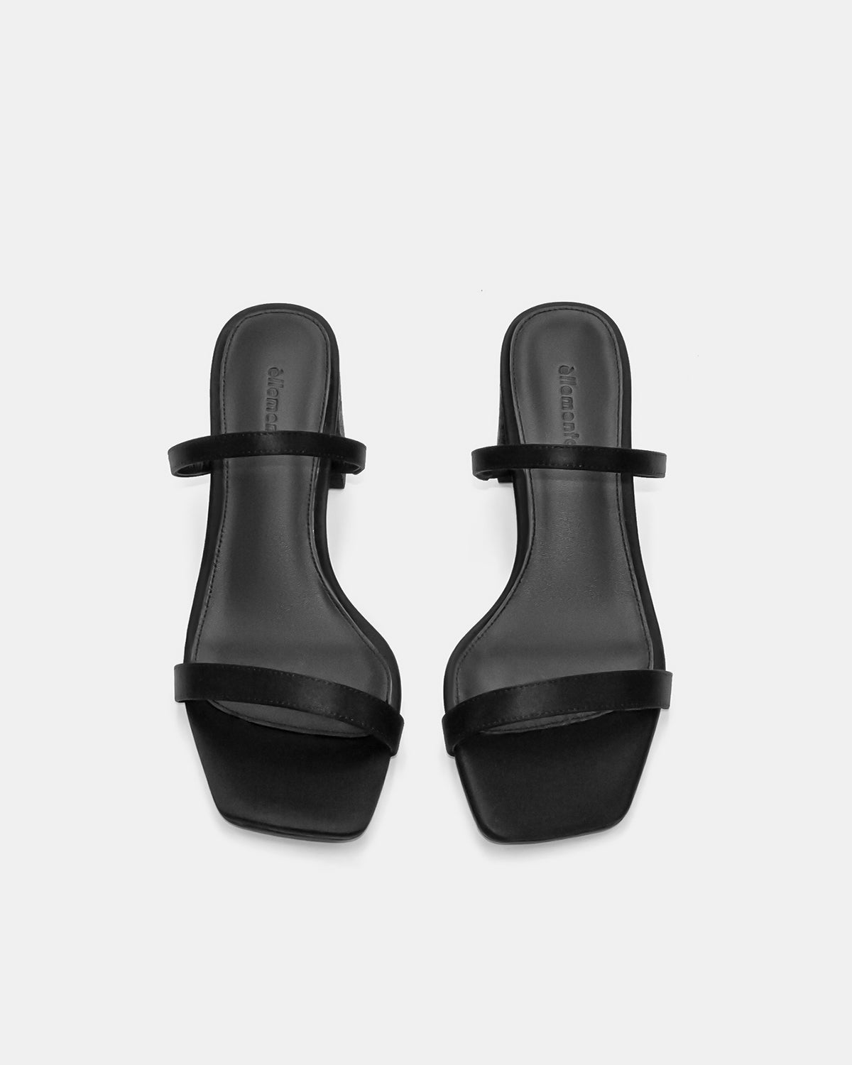 Black sandals with cushioned leather footbed and straps for women
