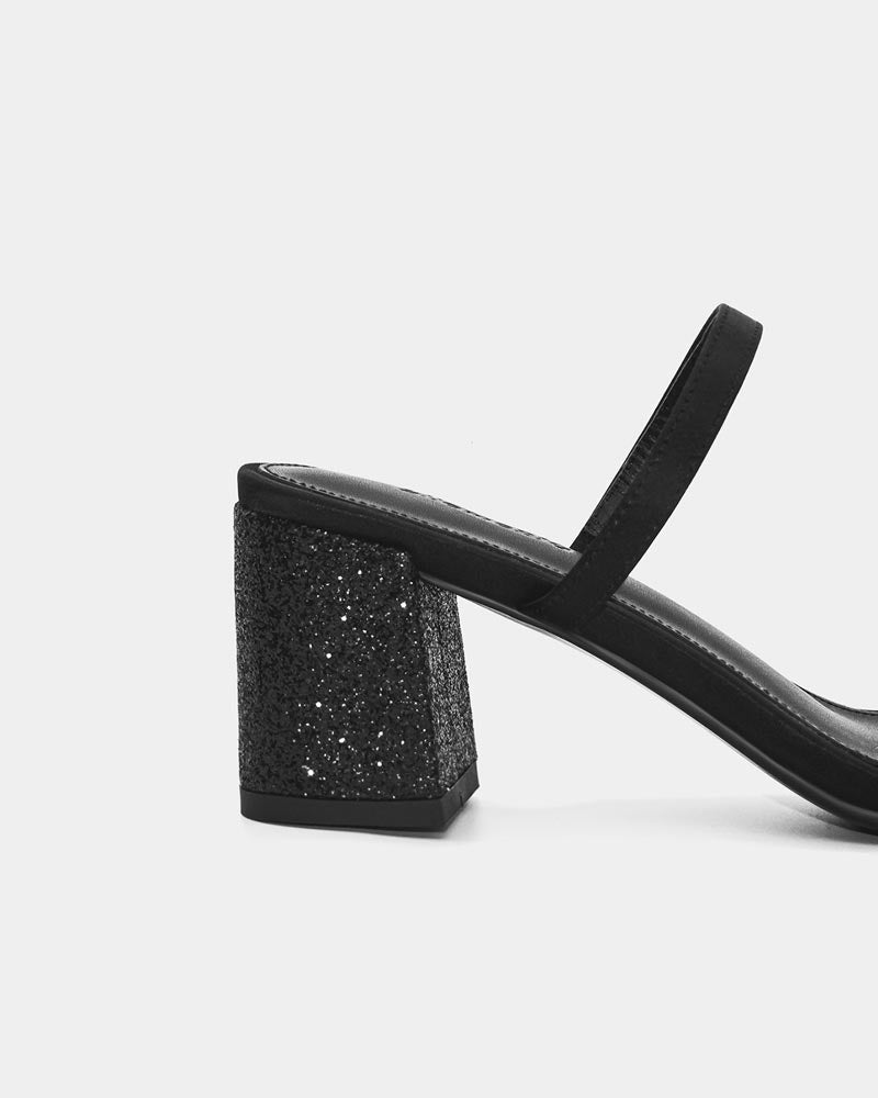 Details of black slide sandals with comfort strap and block heel
