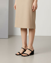 Woman wearing black block heel slide sandals in Australia