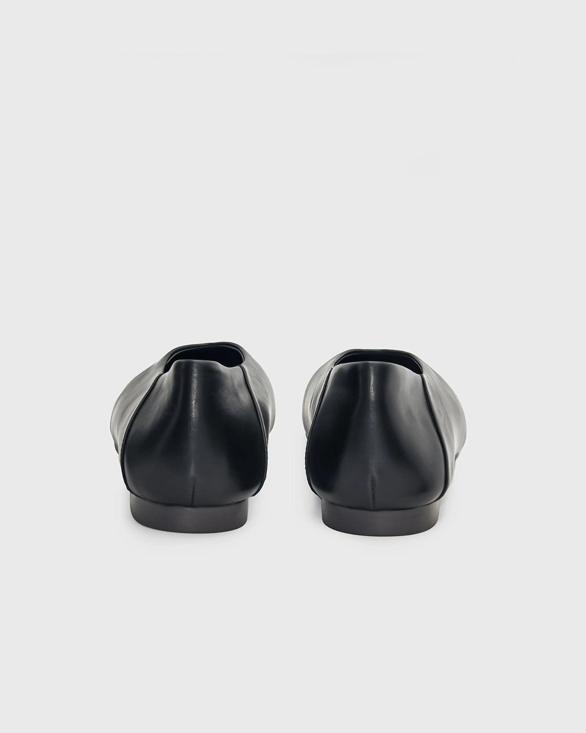 back view of black leather shoes 