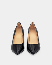 A pair of black leather pointed-toe pumps with a light tan interior lining, shown from a top-down view on a light gray background.