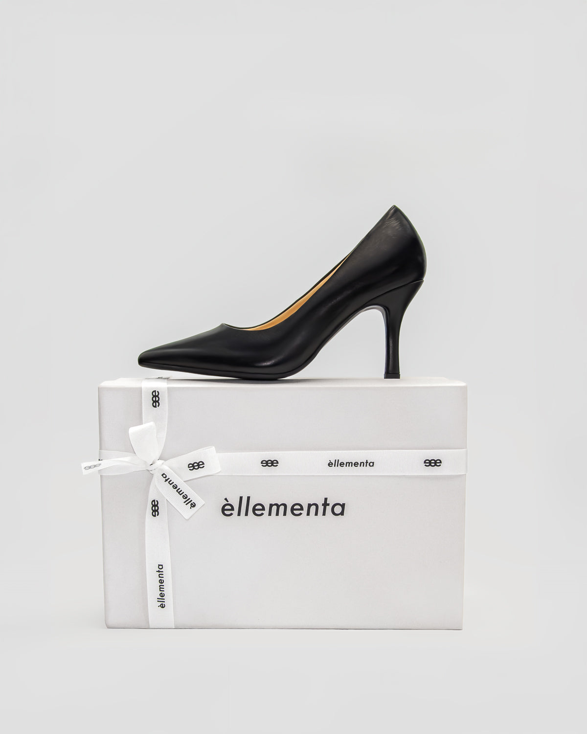 Cushioned heeled pumps in black leather for women with signature packaging Australia