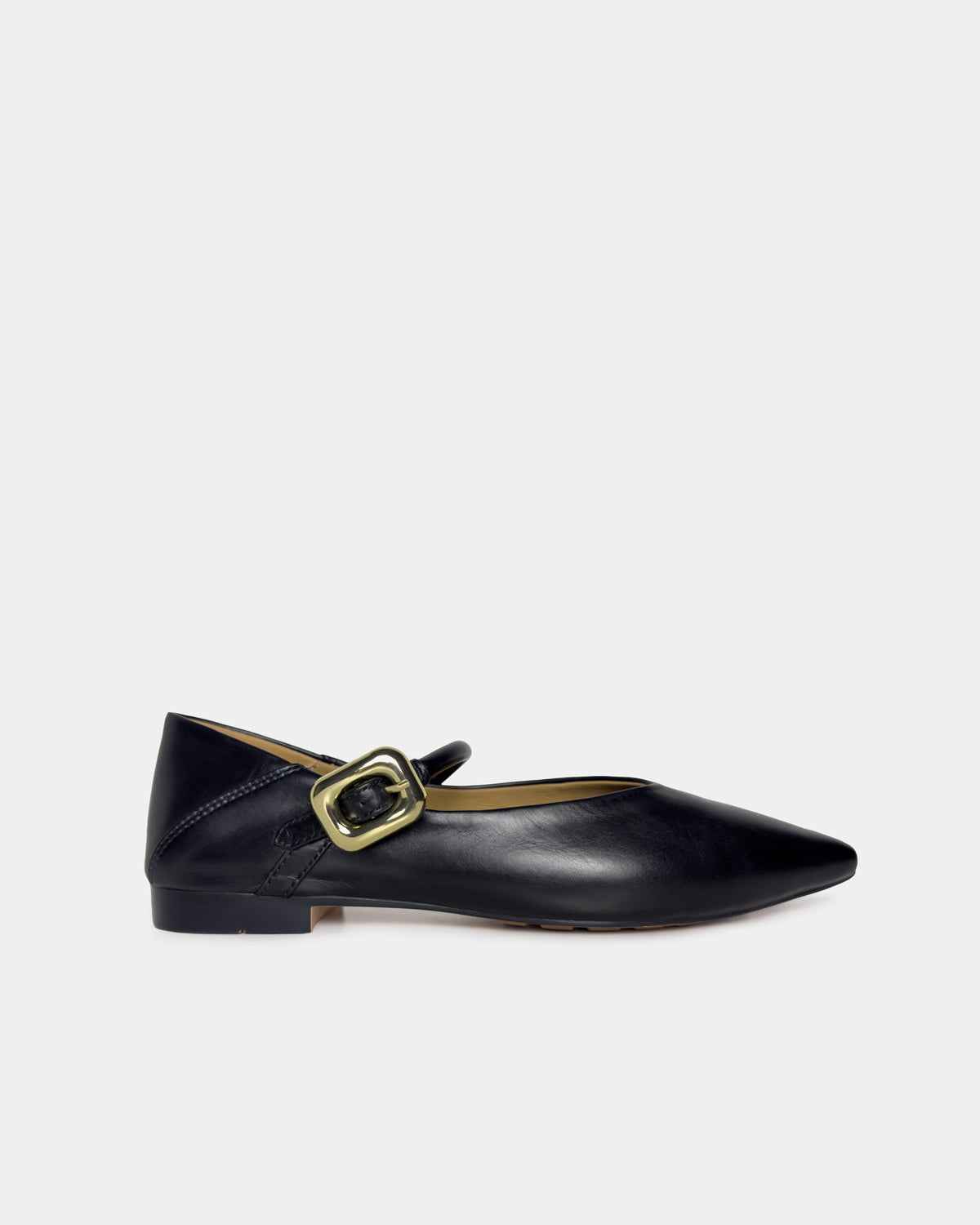 A single black leather flat shoe with a pointed toe and a gold-tone buckle strap, shown in profile against a light gray background.