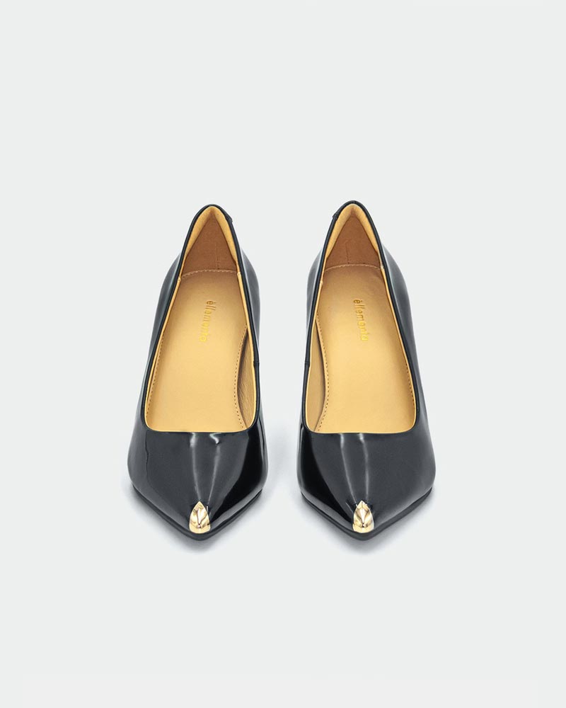 Pair of black high-heeled shoes with gold accents 