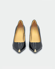 Pair of black high-heeled shoes with gold accents 