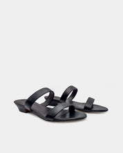 A pair of black leather strappy sandals