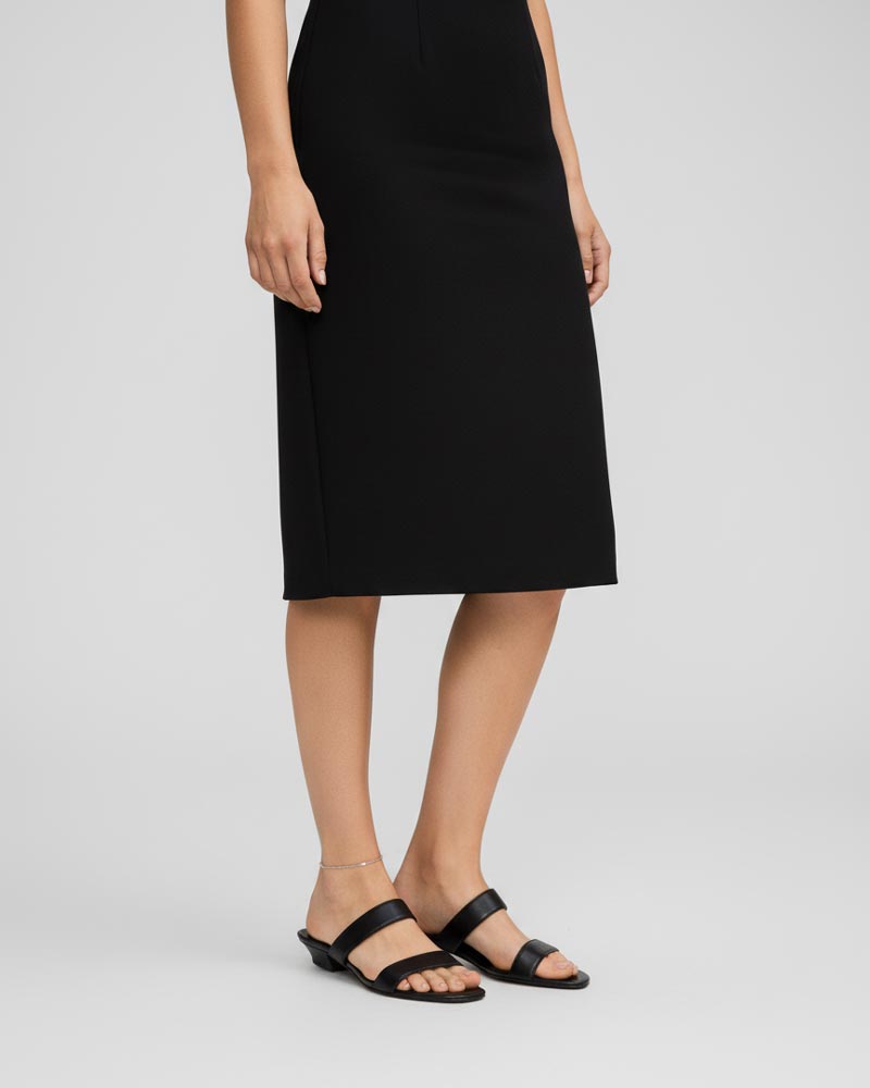 Woman wearing black leather heeled strap sandals Australia