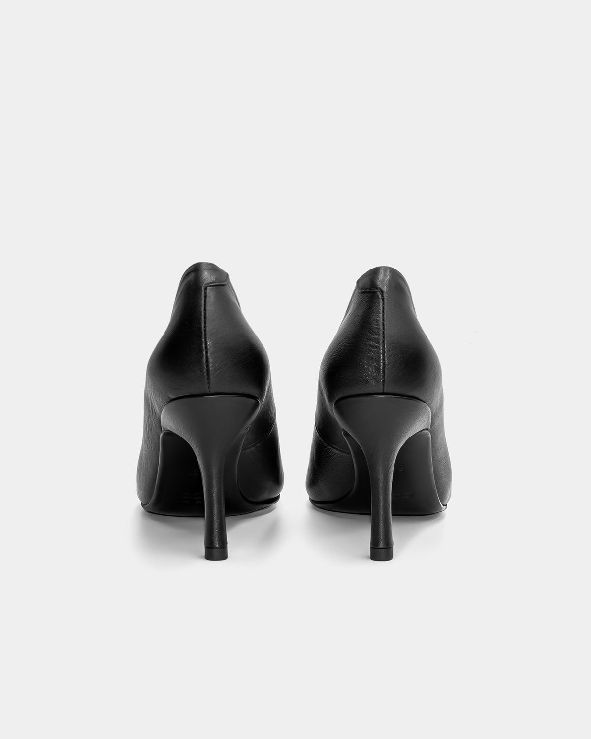 back view of black high heel pumps 