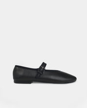 A single black leather Mary Jane ballet flat shoe with a round toe and a small silver buckle, shown in profile against a light gray background.