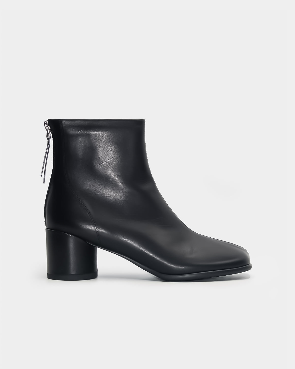 Women's black ankle boots in calf leather with block and back zipper.  