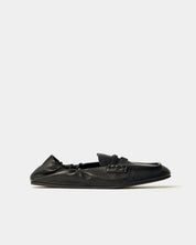 Black loafer shoe on a white background
