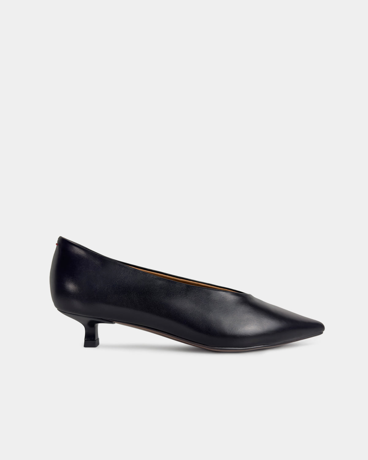A single black leather pointed-toe kitten heel pump shown in a side profile against a light gray background.