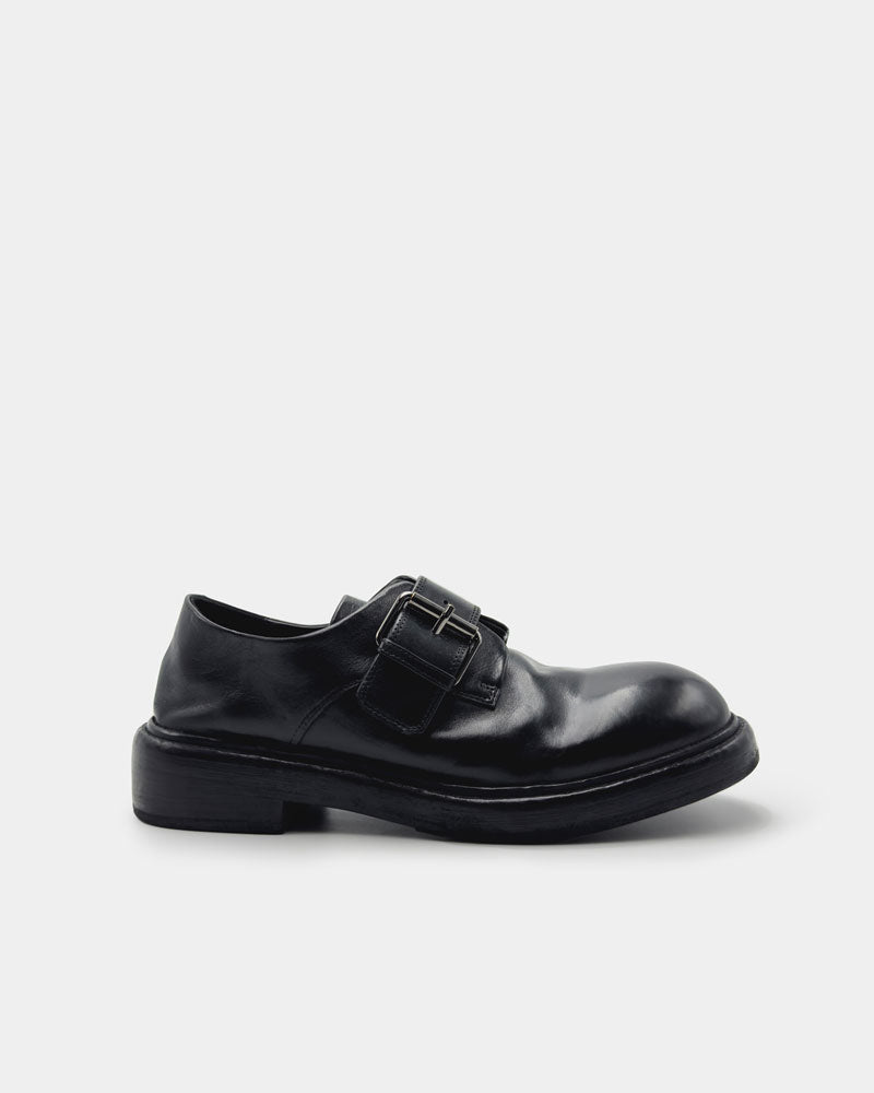 Side view of black leather monk loafers for women
