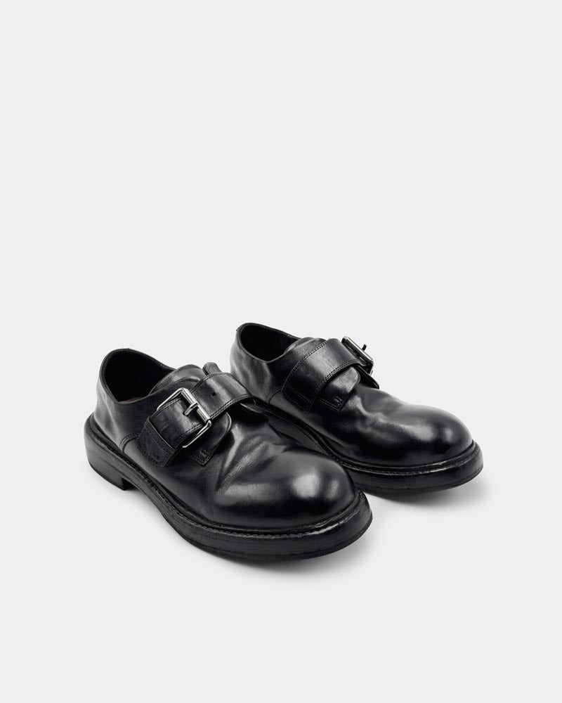 Pair of black leather monk loafers with adjustable buckles 