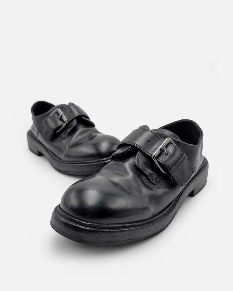 Pair of black monk strap shoes for women