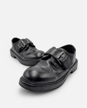 Pair of black monk strap shoes for women