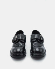 Pair of women's black leather monk loafers with structured support 