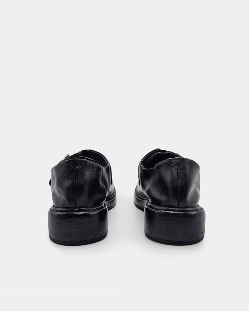 Soft leather back heel of women's black loafers