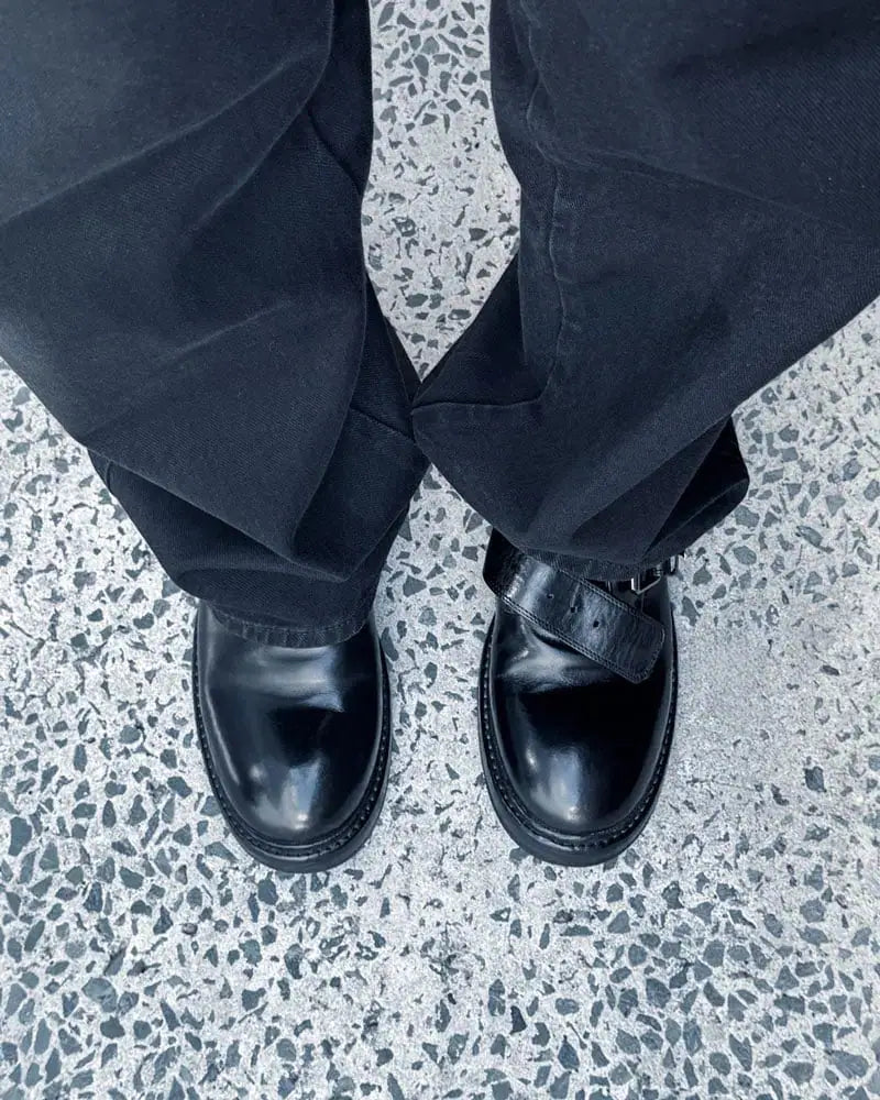 Woman wearing monk loafer with strap in soft black leather 