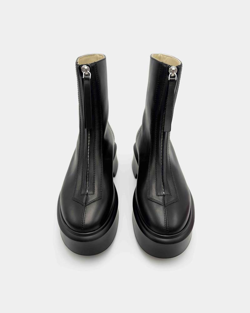 a pair of black platform ankle boots