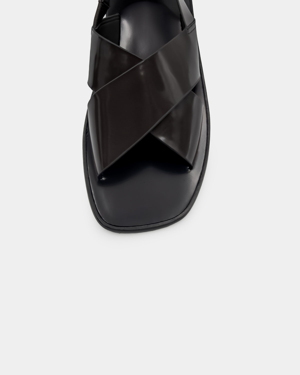 Women's black sandals in leather with crossover strap design