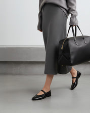 black ballet flats styled for office look and comfortable as travel flats for women