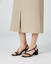 Woman wearing black strappy sandals Patent leather and block heels Australia