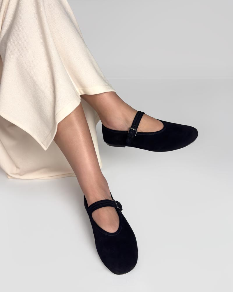 Black ballet flats with strap pair with skirt 