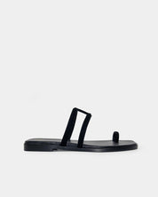 Black slip on sandals in suede leather with secure toe ring that are perfect holiday shoes for ladies