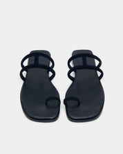 Pair of black slide sandals with cushioned leather footbed