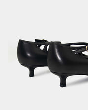 Back view of black kitten heels in leather