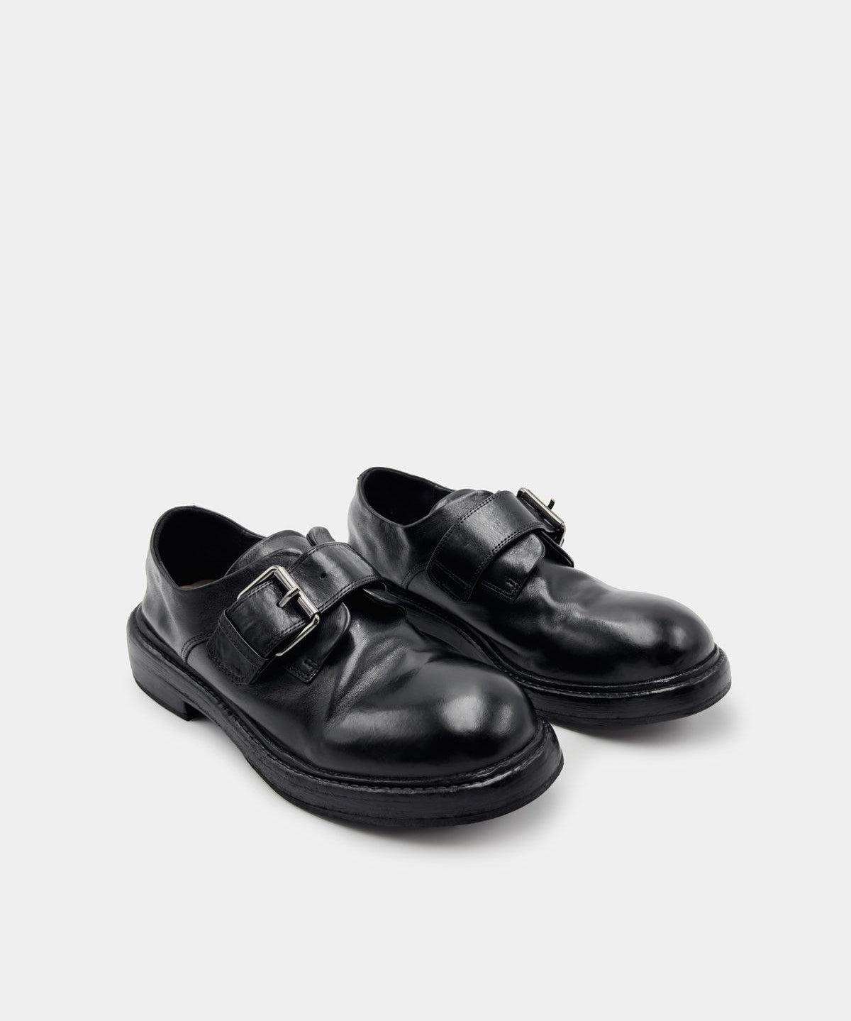 Women’s black calfskin monk strap loafers, chunky lug sole for all-day comfort.