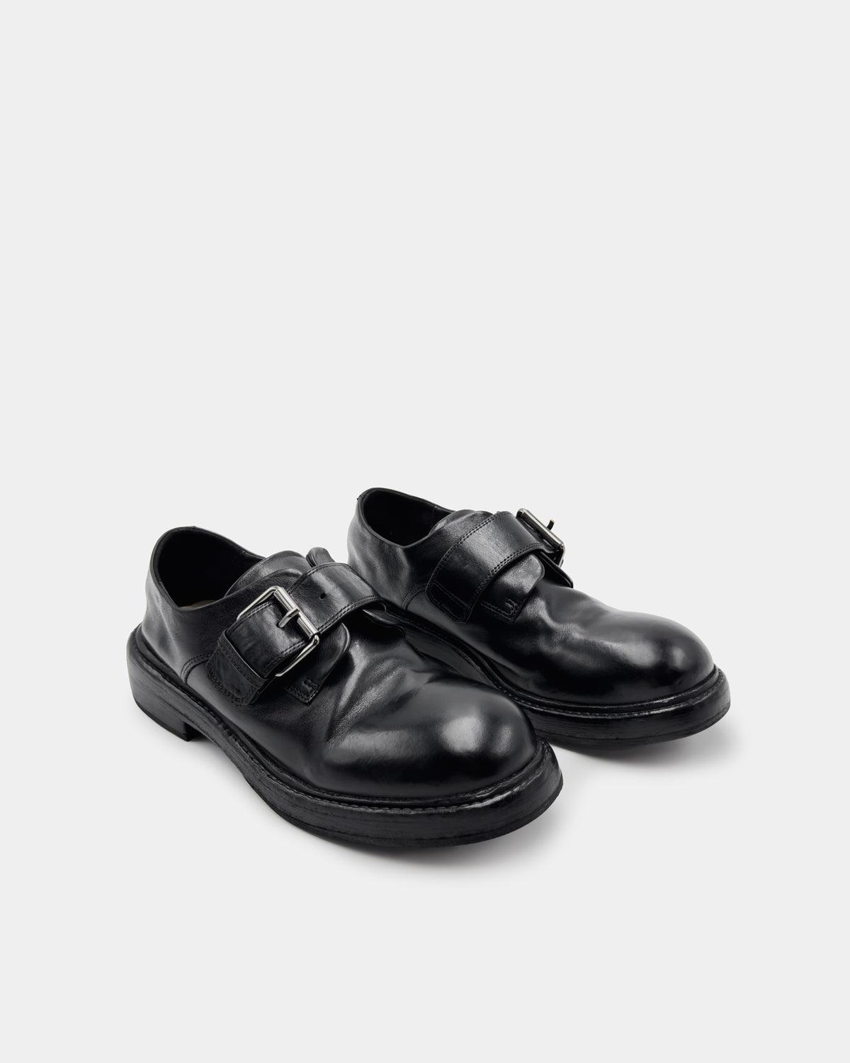 Women’s black calfskin monk strap loafers, chunky lug sole for all-day comfort.