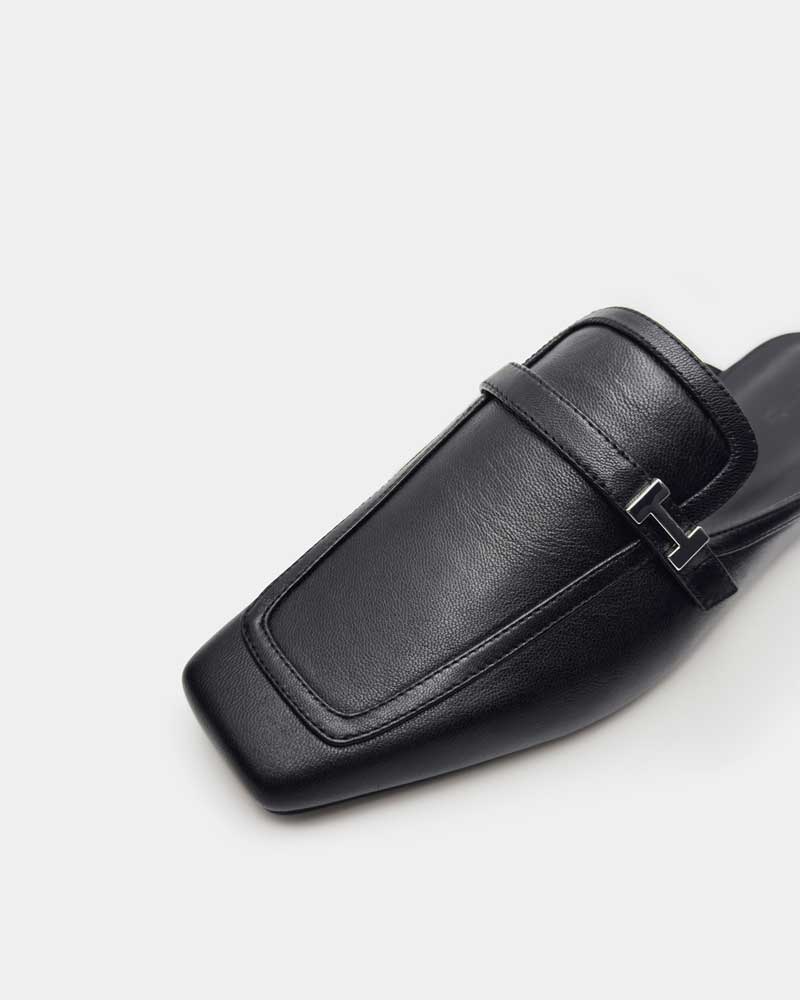 Modern lack leather loafer mules with square toe and silver buckle