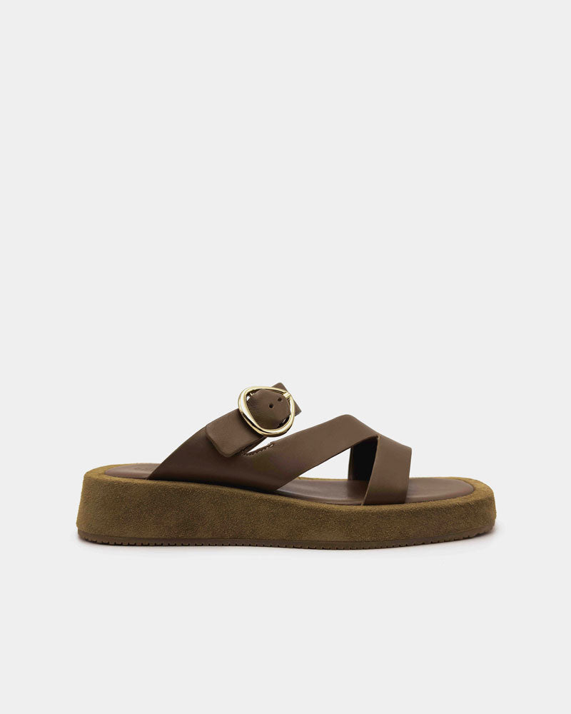 Brown sandal with a gold buckle and straps