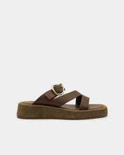 Brown sandal with a gold buckle and straps