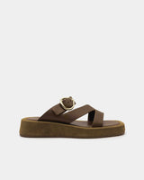Brown sandal with a gold buckle and straps