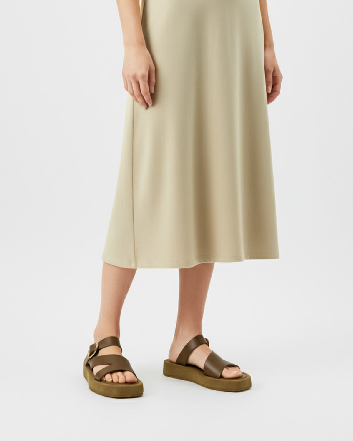 Women's brown platform sandals with gold straps in suede leather