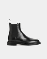 Side view of black leather Chelsea boots 