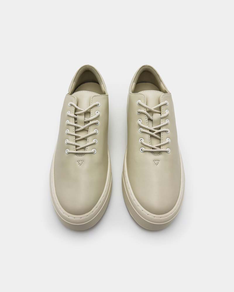 a pair of ivory leather platform sneakers