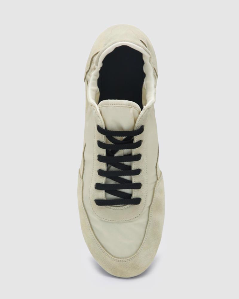 top view of suede sneakers in creamy white leather
