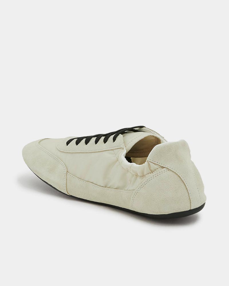 elastic back detail of suede sneakers in white